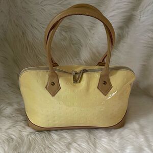 Arcade Genuine Italian patent leather logo yellow and tan satchel dome b…